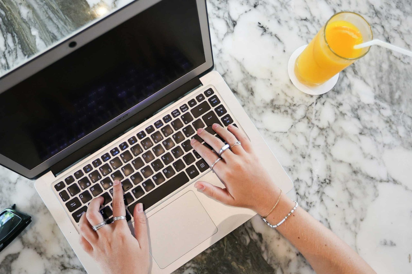 Business owner writing blog content on laptop in modern office — blogging for SEO and content marketing in 2025